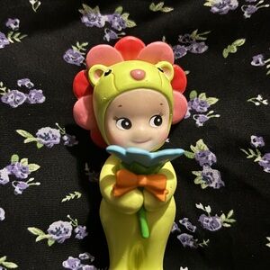 Whimsical Green and Pink Doll with Flower Headpiece